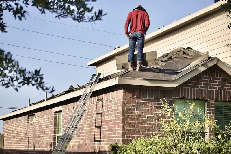 Professional roofer working on a residential roof in San Antonio Heights